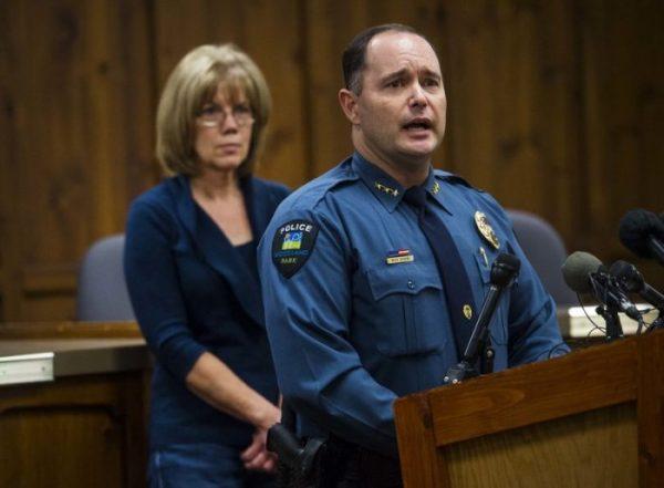 Woodland Park Police Chief Miles De Young answers questions about the disappearance of resident Kelsey Berreth, 29, while her mother, Cheryl Berreth, stands in the background during a news conference at City Hall in Woodland Park, Colo. (Christian Murdock/The Gazette via AP)