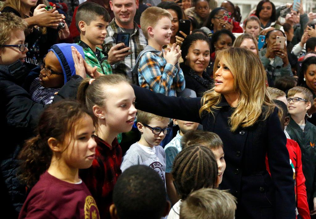 First lady Melania Trump greets children from the Burbank and Bethel Manor Elementary schools during a tour of Joint Base Langley in Hampton, Va., on Dec. 12, 2018. (Steve Helber/AP)