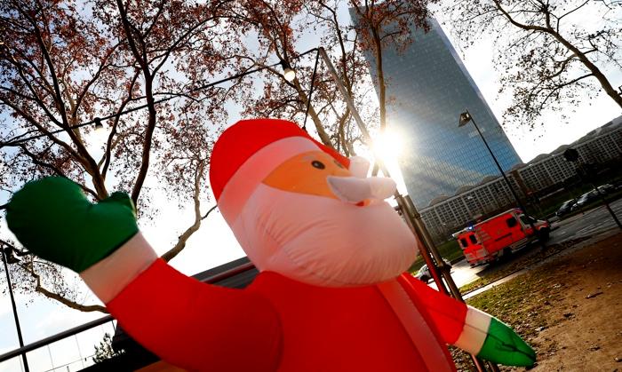 An inflatable Santa Claus near the European Central Bank (ECB) headquarters in Frankfurt, Germany on Dec. 13, 2018. (Reuters/Kai Pfaffenbach)