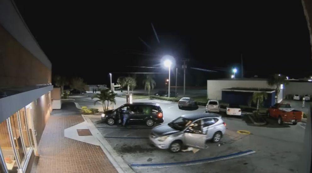 Surveillance video footage released by a local police department in Florida shows the moment an elderly woman was almost hit by a car during a purse-snatching incident at a McDonald's. (Okeechobee Police Department)