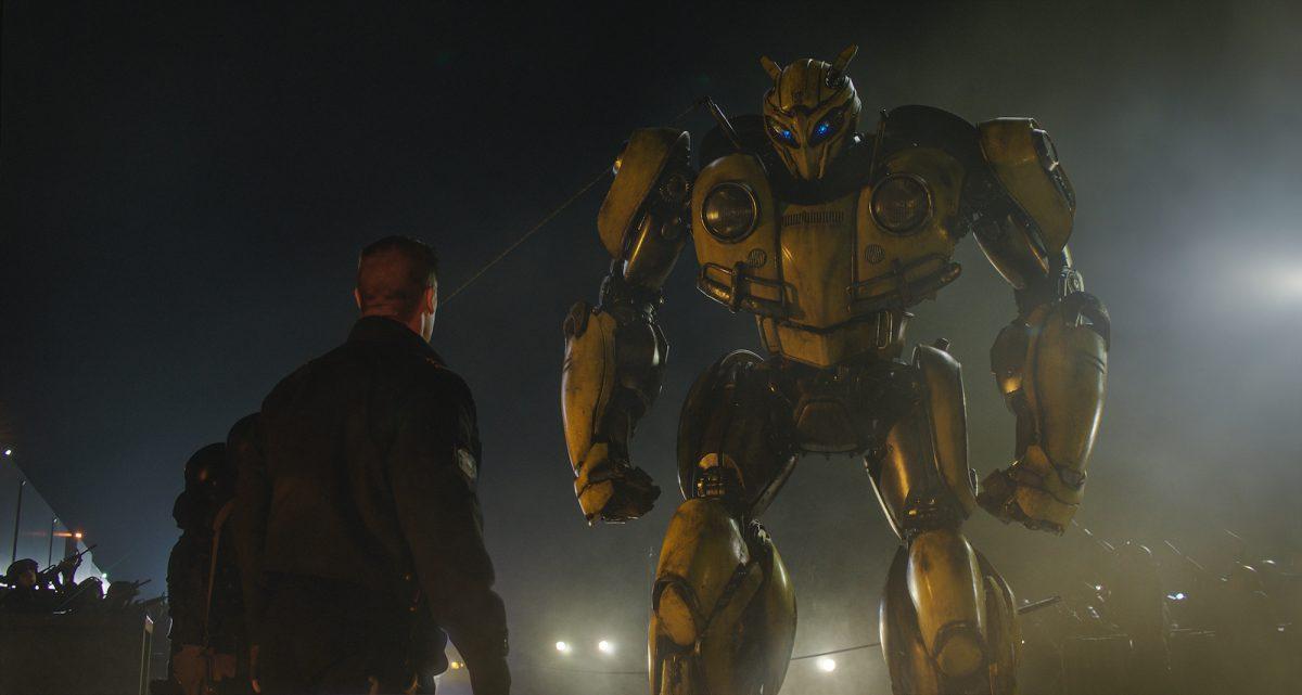 John Cena as Agent Burns and Bumblebee in fight mode, in “Bumblebee,” from Paramount Pictures. (Paramount Pictures/Hasbro)