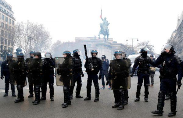 French riot police stand guard during a demonstration by the "yellow vests" movement in Paris, France, Dec. 15, 2018. (Reuters/Gonzalo Fuentes)