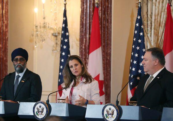 (L-R) Canadian Minister of National Defence Harjit Sajjan, U.S. Secretary of State Mike Pompeo, and Canadian Minister of Foreign Affairs Chrystia Freeland at a press conference on Dec. 14, 2018, in Washington. (Mark Wilson/Getty Images)