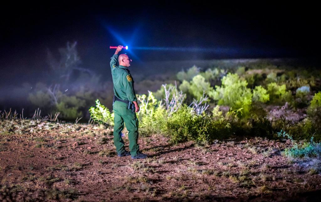 FILE- Border Patrol agents wait for other units in the Animas Valley in New Mexico's boot heel area, on June 23, 2015. (Roberto E. Rosales/The Albuquerque Journal via AP, File)