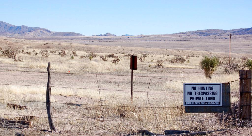 This Jan. 20, 2012, file photo, near Cloverdale in New Mexico's Bootheel region shows a gated part of the Diamond A Ranch and is 77 miles south of Lordsburg, N.M., the nearest U.S. Border Patrol station. (AP Photo/Russell Contreras, File)