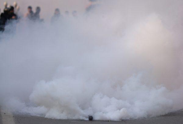 A tear gas shell fired by Indian police explodes during a protest march in Srinagar on Dec. 17, 2018. (Danish Ismail/Reuters)