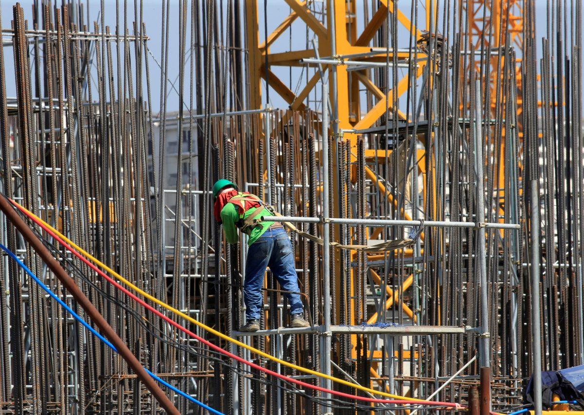  A worker installs steel rods at a construction site in Paranaque city, Metro Manila, Philippines, on May 29, 2018. (Romeo Ranoco/Reuters)