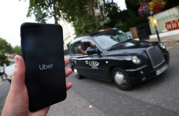 The Uber application is seen on a mobile phone in London, Britain, on Sept. 14, 2018. (Hannah McKay/Reuters)