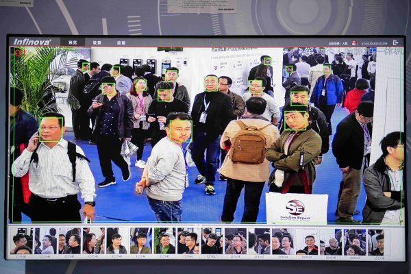 A screen shows visitors being filmed by artificial intelligence security cameras with facial recognition technology in Beijing on Oct. 24, 2018. (Nicolas Asfouri/AFP/Getty Images)