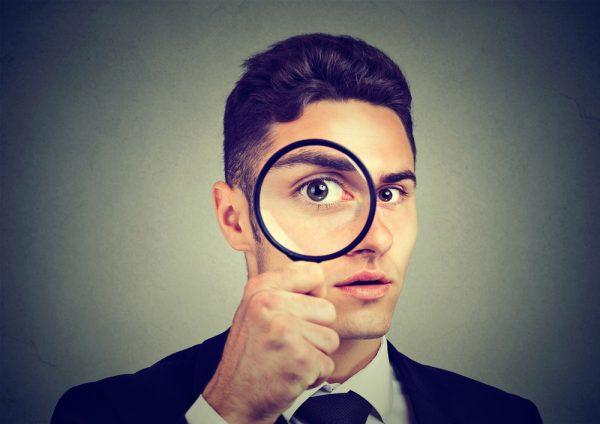 Illustration - Shutterstock | <a href="https://www.shutterstock.com/image-photo/curious-man-looking-through-magnifying-glass-717263917?src=93yAGgHDyLB7yGb7VMehcw-1-22">FGC</a>