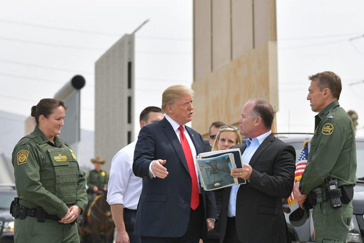 President Donald Trump (C) is shown border wall prototypes in San Diego, Calif., on March 13, 2018. (Mandel Ngan/AFP/Getty Images)