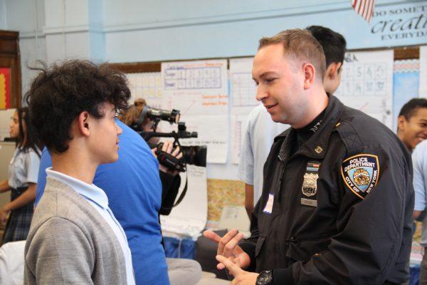 A NYPD police officer speaks with a young mentee. (Courtesy of BBBS of NYC)