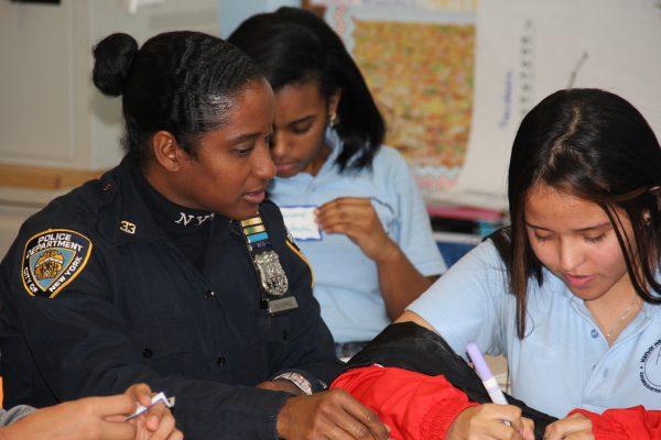 A NYPD police officer mentoring a young girl. (Courtesy of BBBS of NYC)