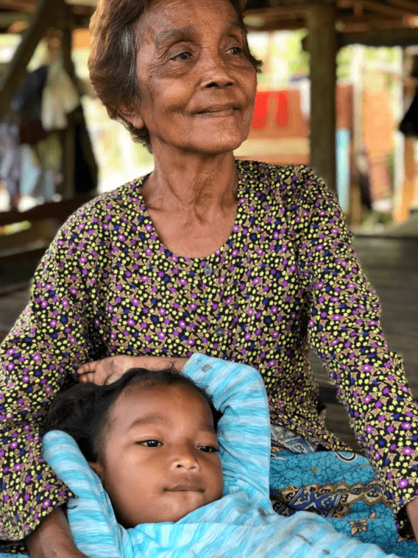 An unidentified woman holding a child. (Cambodian Children’s Trust)