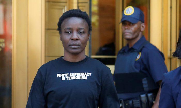 Therese "Patricia" Okoumou walks out of federal court from her arraignment, a day after authorities said she scaled the stone pedestal of the Statue of Liberty, in Manhattan, New York, on July 5, 2018. (Shannon Stapleton/Reuters)