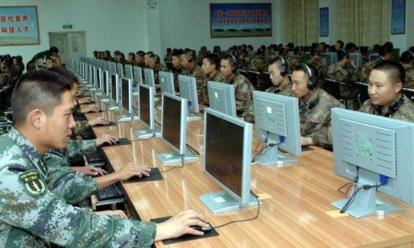  Chinese soldiers work at computers. The Chinese regime's cyberattacks against the West have continued despite cyber agreements. (mil.huanqiu.com)