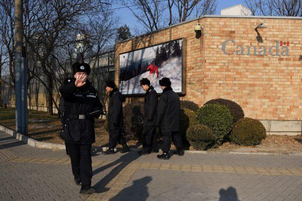 Chinese police patrol in front of the Canadian embassy in Beijing, on Dec. 14, 2018. (GREG BAKER/AFP/Getty Images)