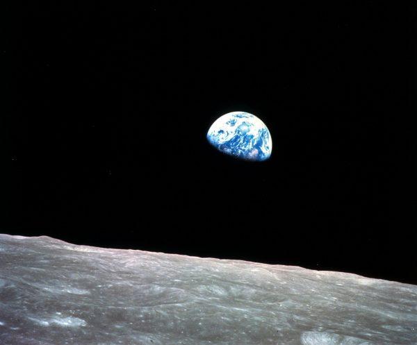 Photo made available by NASA shows the Earth behind the surface of the moon during the Apollo 8 mission, on Dec. 24, 1968. (William Anders/NASA/AP)