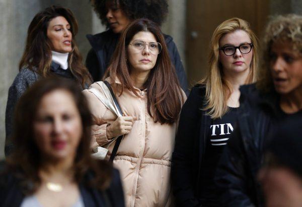 Marisa Tomei, center, leaves New York Supreme Court after attending a hearing in the Harvey Weinstein sexual assault case, in New York, on Dec. 20, 2018. Judge James Burke allowed the sexual assault case to move forward. (AP Photo/Julio Cortez)