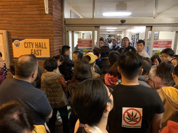 Opponents of the cannabis project waited at the door of El Monte City Hall in El Monte, California on Dec. 19, 2018. (Jenny Liu/The Epoch Times)