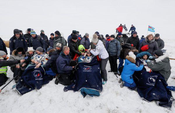 The International Space Station crew members rest after the landing of the Soyuz MS-09 capsule near the town of Zhezkazgan, Kazakhstan, on Dec. 20, 2018. (Reuters/Shamil Zhumatov)