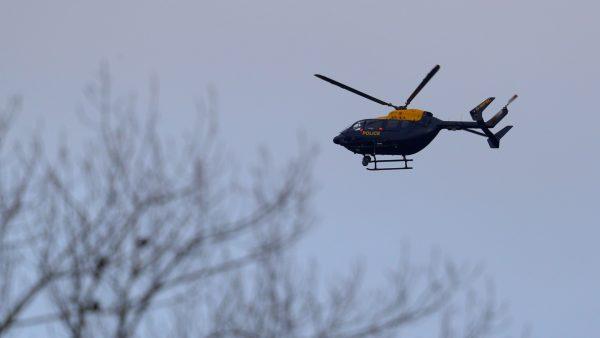 A Police helicopter flies over Gatwick Airport as they search for the Drone operator causing closure of the airport in London, England, on Dec. 20, 2018. (Dan Kitwood/Getty Images)