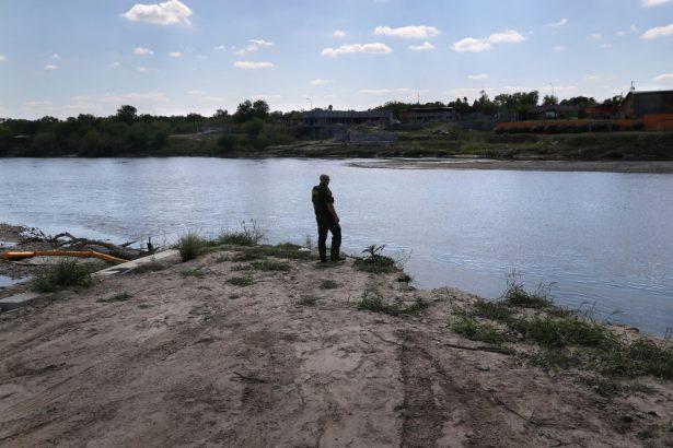 A U.S. Border Patrol agent looks into Mexico from the bank of the Rio Grande at the U.S.-Mexico border in Texas, on March 14, 2017. (John Moore/Getty Images)