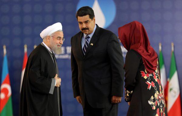 Iranian President Hassan Rouhani (L), greets his Venezuelan counterpart Nicolas Maduro and Venezuela's First Lady Cilia Flores during the Gas Exporting Countries Forum (GECF) summit in Tehran on Nov. 23, 2015. (Atta Kenare/AFP/Getty Images)