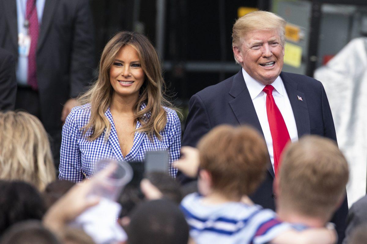 President Donald Trump and First Lady Melania Trump greet guests during a picnic for military families at the White House, on July 4, 2018. (Alex Edelman/Getty Images)