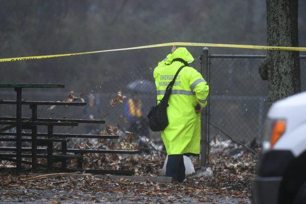 An investigator works the scene of a small plane crash in a city park which killed all on board in northwest Atlanta, on Dec 20, 2018. (John Amis/AP)