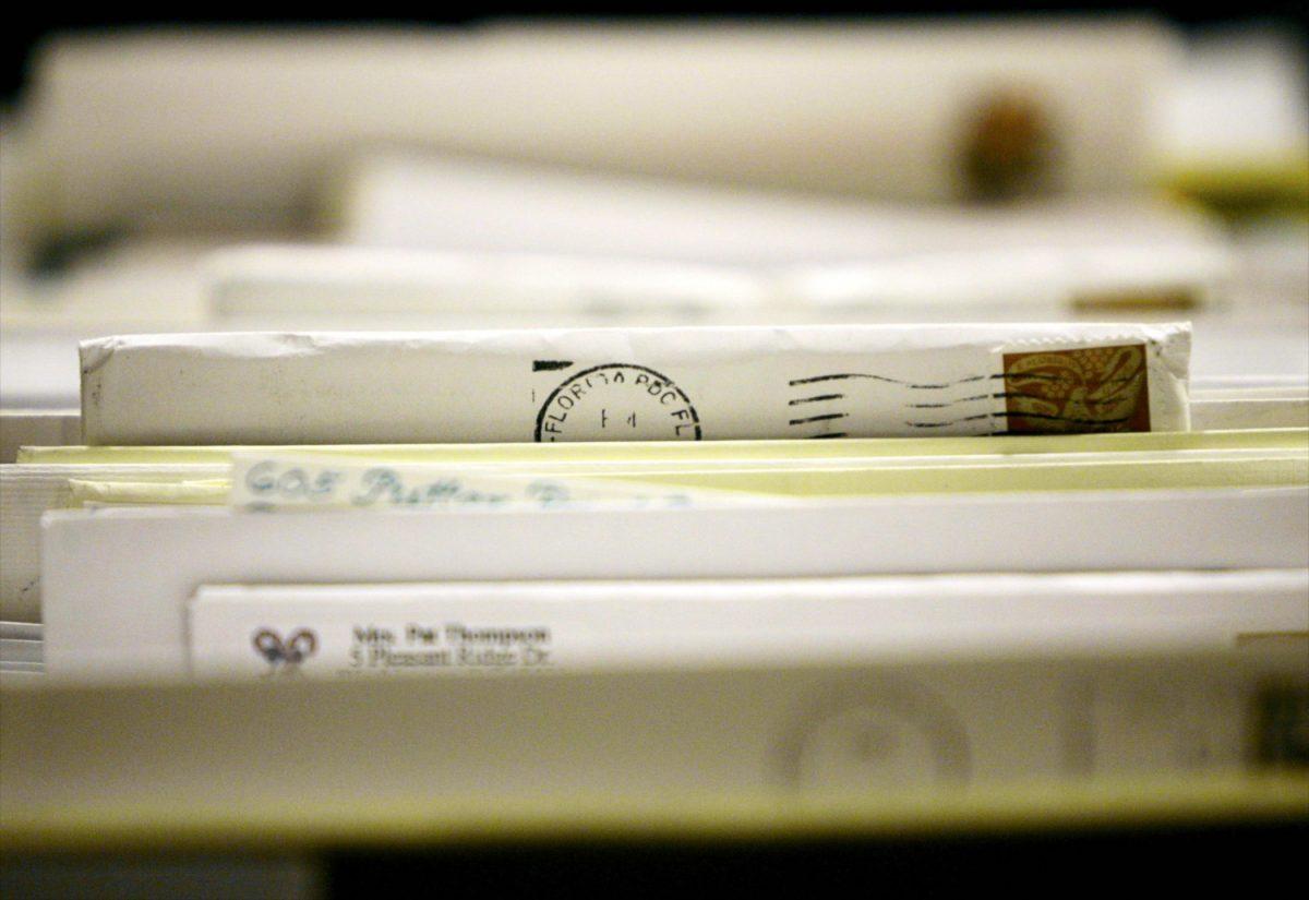 Pieces of mail wait to be sorted at the Merrifield Postal Center on Dec. 20, 2004. (Win McNamee/Getty Images)