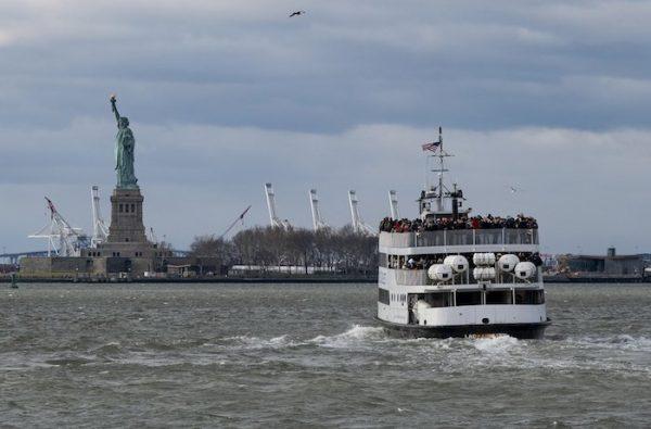 A ferry full of passengers steams towards the Statue of Liberty on Dec. 22, 2018, in New York. (AP Photo/Craig Ruttle)