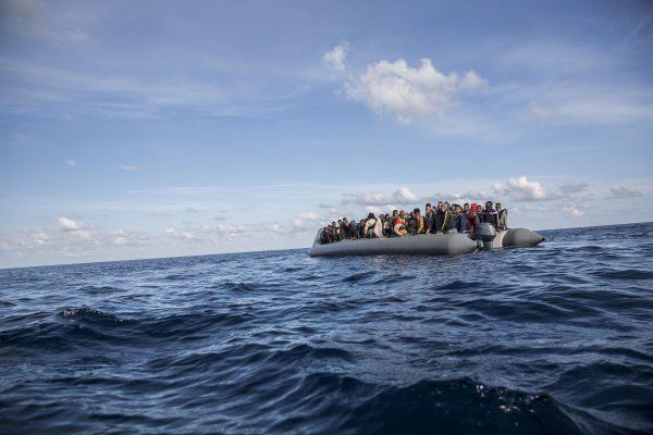 Migrants sit in a rubber dinghy after Proactiva Open Arms, a Spanish NGO, spotted and rescued them in the Central Mediterranean Sea at 45 miles (72 kilometers) from Al Khums, Lybia, on Dec. 21, 2018. (Olmo Calvo/AP)