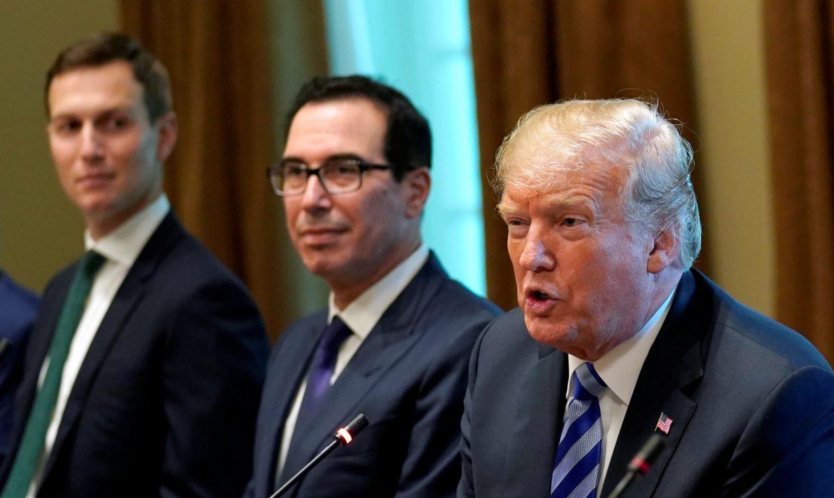 President Donald Trump, seated with Treasury Secretary Steve Mnuchin in Washington, D.C. on Sept. 5, 2018. (Kevin Lamarque/Reuters)