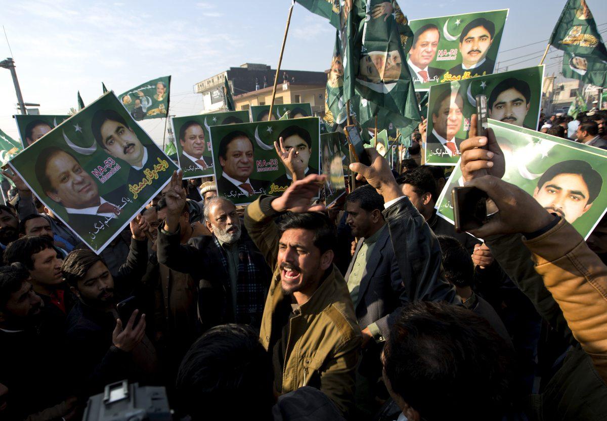 Supporters of former Pakistani Prime Minister Nawaz Sharif shout slogans against the government outside an accountability court in Islamabad, Pakistan, Monday, Dec. 24, 2018. (AP Photo/B.K. Bangash)