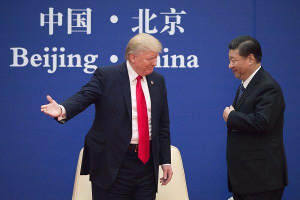 U.S. President Donald Trump and Chinese leader Xi Jinping during a business leaders<span style="font-weight: 400;">’</span> event at the Great Hall of the People in Beijing on Nov. 9, 2017. (Nicolas Asfouri/AFP/Getty Images)