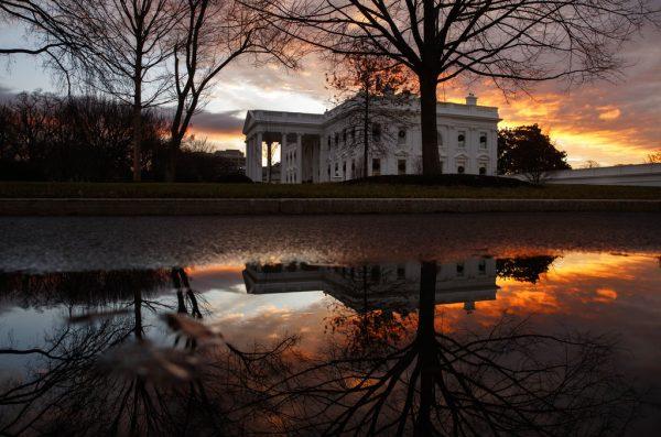 The sun rises behind the White House on Dec. 22, 2018. (Carolyn Kaster/AP)