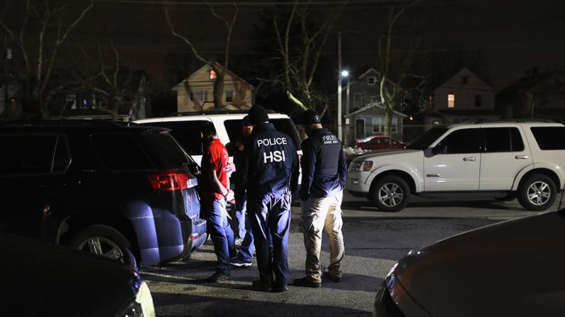 Homeland Security Investigations (HSI) ICE agents detain a suspected MS-13 gang member during Operation Matador in Brentwood, New York, on March 29, 2018. (John Moore/Getty Images)