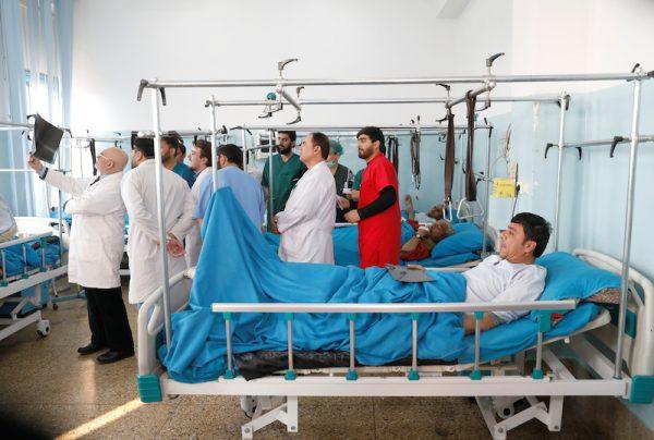 Injured men receive treatment at the hospital after an attack in Kabul, Afghanistan on Dec. 25, 2018. (Mohammad Ismail/Reuters)
