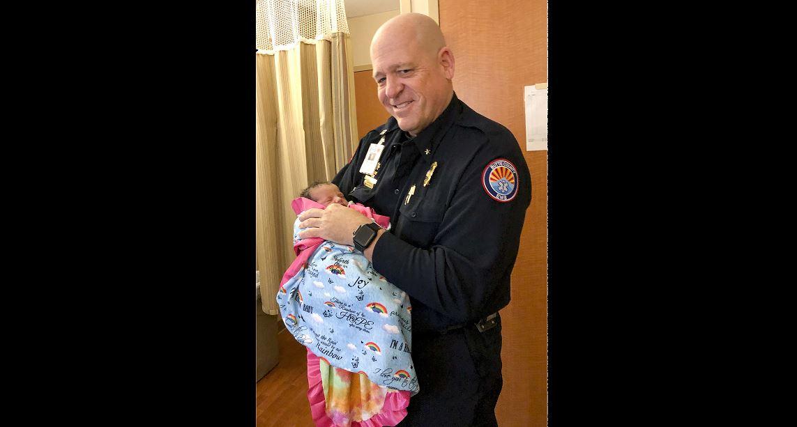 Paramedic Mickey Huber holds 2-day-old baby Zoele Mickey Skinner at Enloe Medical Center in Chico, Calif., on Dec. 14, 2018. (Daniel Skinner via AP)