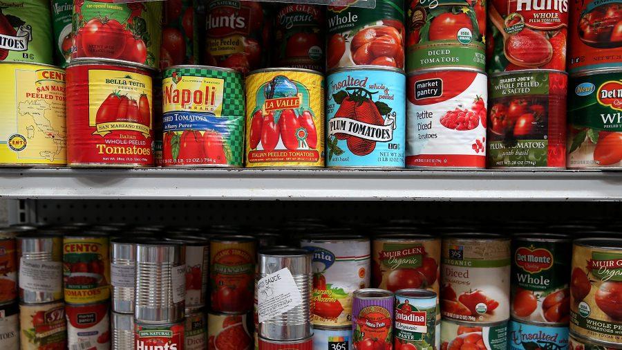 Canned tomatoes line the shelves of a pantry at the SF-Marin Food Bank in San Francisco, Calif. on May 1, 2014. (Justin Sullivan/Getty Images)