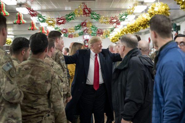 President Donald Trump visits with members of the military at a dining hall at Al Asad Air Base, Iraq on Dec. 26, 2018. (Andrew Harnik/AP)