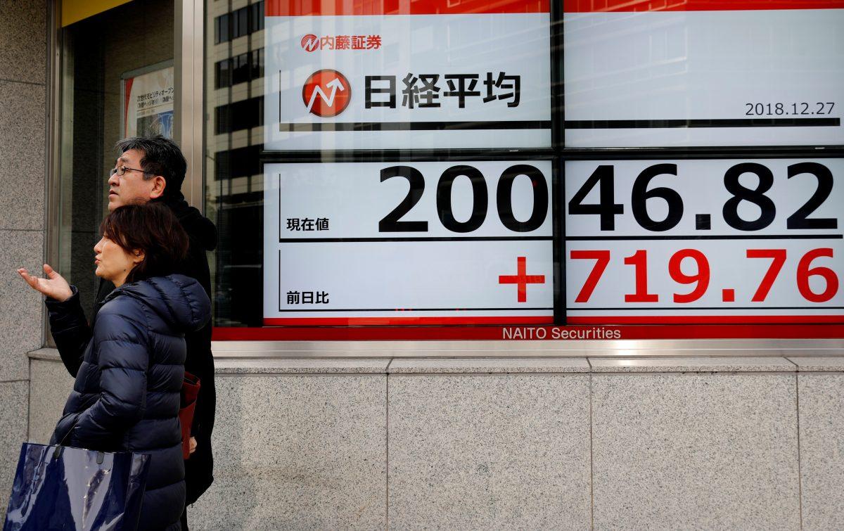 An electronic board showing Nikkei share average outside a brokerage in Tokyo, Japan on Dec. 27, 2018. (Kim Kyung-Hoon/Reuters)