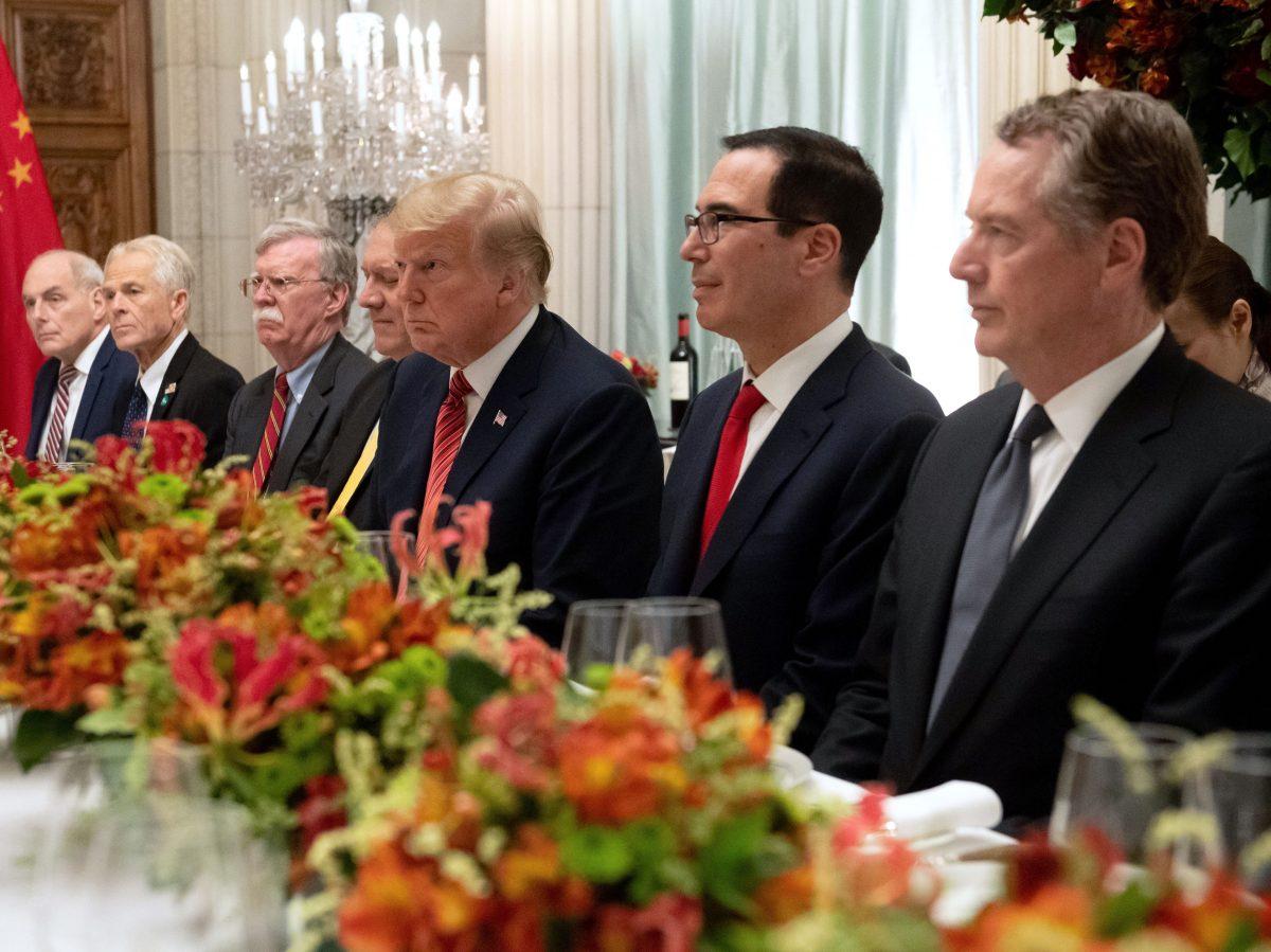 President Donald Trump (C), Secretary of the Treasury Steven Mnuchin (2nd R), Trade Representative Robert Lighthizer (R), White House Chief of Staff John Kelly (L), assistant to the president Peter Navarro (2nd L), national security adviser John Bolton (3rd L), and Secretary of State Mike Pompeo hold a dinner meeting with Chinese leader Xi Jinping (not pictured) at the G-20 summit in Buenos Aires, Argentina, on Dec. 1, 2018. (Saul Loeb/AFP/Getty Images)