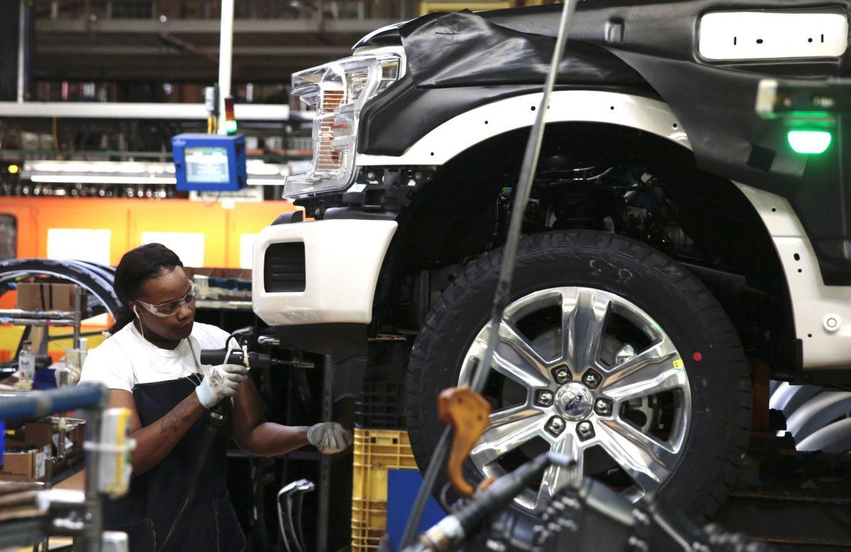 An employee works on the assembly line for the Ford 2018 and 2019 F-150 truck at the Ford Motor Company's Rouge Complex in Dearborn, Mich., on Sept. 27, 2018. (JEFF KOWALSKY/AFP/Getty Images)