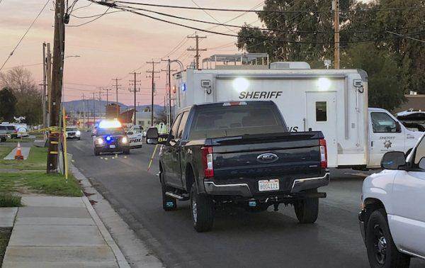 Police investigate the scene of a shooting that took the life of Newman Police Officer Ronil Singh, 33, in Newman, Calif., on Dec. 26, 2018, (Deke Farrow/The Modesto Bee via AP)