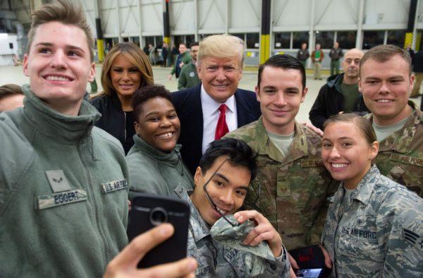 President Donald Trump and First Lady Melania Trump greet members of the US military during a stop at Ramstein Air Base in Germany, on Dec. 27, 2018. (Saul Loeb/AFP/Getty Images)