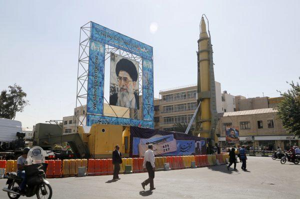A Ghadr-F missile is displayed next to a portrait of Iran<span style="font-weight: 400;">’</span>s Supreme Leader Ayatollah Ali Khamenei in Tehran, Iran, on Sept. 26, 2016. (Atta Kenare/AFP/Getty Images)
