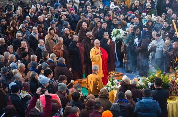This photo taken on Dec. 3, 2017 shows Xuecheng (C), the abbot of Beijing's Longquan Monastery, praying during a ceremony in Xinzhou in northern China's Shanxi province. The former head of China's government-run Buddhist association is under criminal investigation for alleged sexual assault. Xuecheng, a Communist Party member, is one of the most prominent figures to face accusations in China's growing #MeToo movement. (STR/AFP/Getty Images)