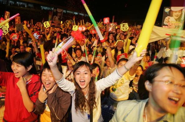 Fans cheer during the "Super Girl Concert" in Chengdu of Sichuan Province, China on Oct. 1, 2005. (China Photos/Getty Images)